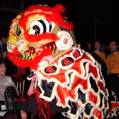 A festive Chinese lion slithered through the packed ballroom.