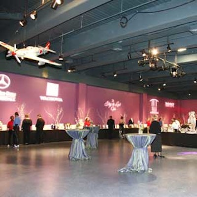 The cocktail reception, held inside the Museum of Discovery & Science, featured airplanes hanging from the roof, gobos, and a large silent auction encircling the room.