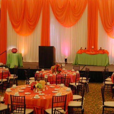 Dramatic orange and white draping jazzed up the stage.