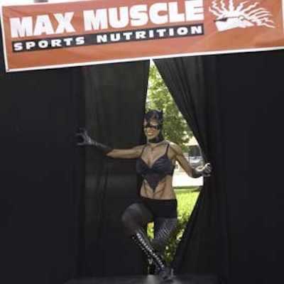 Catwoman clawed her way onto the stage during the hot body contest at the Max Muscle store opening.