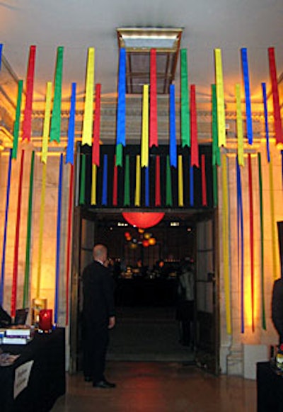 Multicolored ribbons hung from the ceiling, creating a festive entryway into the party.