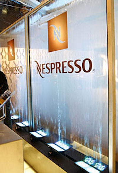 Water ran down the back of a sheet of plexiglass with the espresso company's logo.