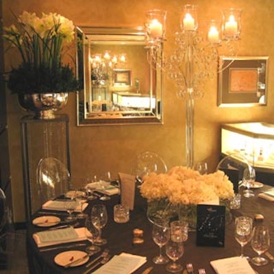 The upper-level dining space at Tiffany & Co. also featured a brown colour palette, accented by acrylic candelabra centrepieces and large flower arrangements from Forget Me Not Flowers.