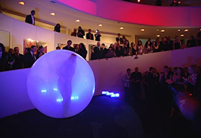 Burlesque artist Julie Atlas Muz performed a dramatic dance with a large balloon. She entered it, then burst free in the end.