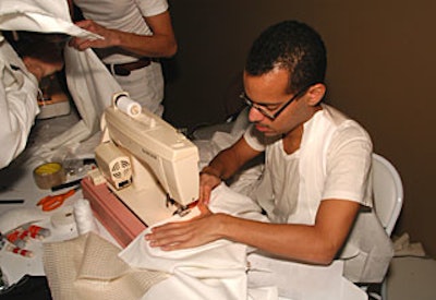 For guests who didn’t heed the invitation’s instructions to dress in white, Carlos Soto and other volunteers of a part-performance, part-utilitarian service called the Emergency Sewing Project constructed suitable garments.
