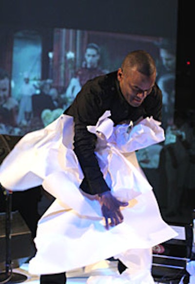 Clifford Owens, a 2005 Performa biennial artist, led a reenactment of Benjamin Patterson’s 1960 “Paper Piece,” creating sound by ripping, rattling, shaking, and biting paper.