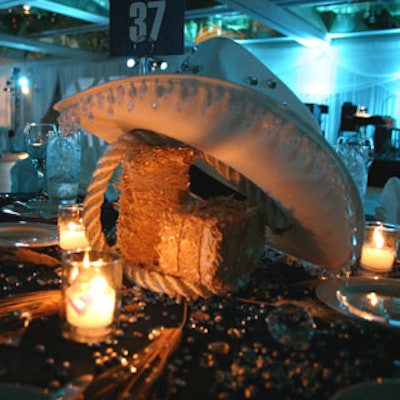 Advantage DMS designed the country-themed tables with rhinestone-studded cowboy hats, mini-bales of hay and lasso rope for a down-home feel.