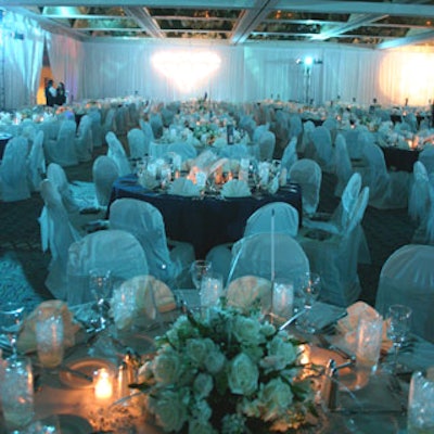White and blue denim tablecloths along with white gauze-covered banquet chairs were used to create the opulent dining room for the jeans-and-gems-wearing guests.
