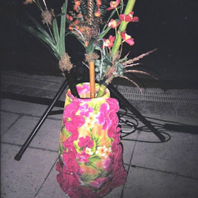 A few congas were turned upside down so that they resembled huge vases, and different colored bamboo was used to hold artificial flowers in place.