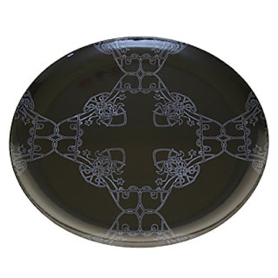 The price is right for Kiln Enamel's latest Rouleau de Fer round, in sleek dark shades with gothic detailing. (15-inch diameter, $40)