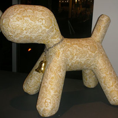 Marcel Wanders' Courage, another of the selected puppies, had a gold bell chained to his neck and a person's face patched in gold on his white skin.