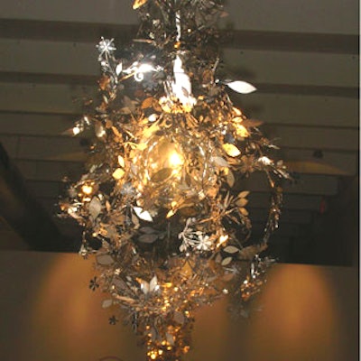 The chandeliers hovering over the tables were composed of a single bright bulb wrapped in a brown vine.