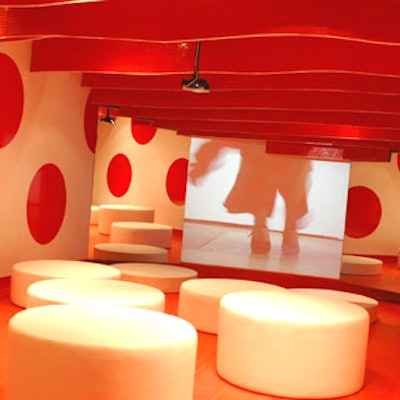 Madrid's Teresa Sapey of Teresa Sapey Architects collaborated with Tile of Spain on this topsy-turvy media room full of red and white whimsy.