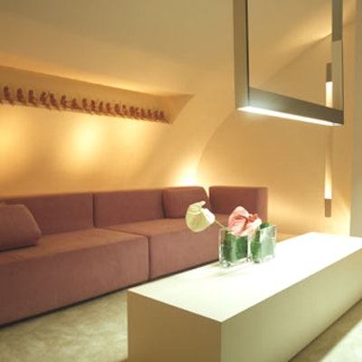 Uli Petzold, general manager of European Architectural Lighting Inc., created a cocoon lounge on the first floor with modern, understated furniture and an unlikely design accent: a row of Barbie dolls showcased above the sofa. Arranged in various poses, all were dressed in two-piece pink outfits to match the sofa.