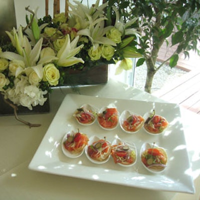 A Joy Wallace prepared fresh smoked salmon mini bagel chips with capers, tomatoes, red onions and frisee for guests to nibble on throughout the day.