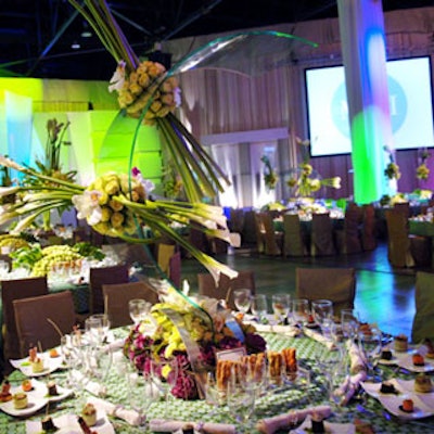 Barton G. combined bunches of lilies and roses with acrylic forms, which made it look as if the centerpieces were floating in midair.