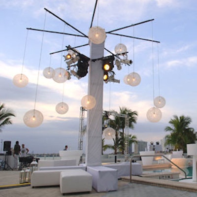Floating above the pool and in between the screens was a mobile of webbed lit spheres, an original Wanders piece.