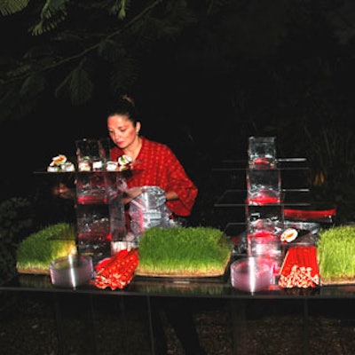 2Taste Catering's sleek acrylic food stations featured wheat grass and stacked glass vases.