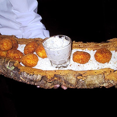 Crab puffs were served in a hollowed-out log, reminding guests of SCOPE's mission to send kids to summer camp.
