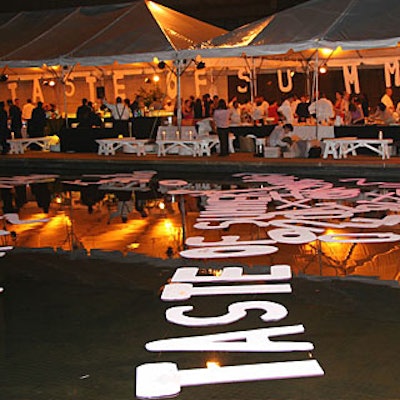Foam core letters spelled out 'Taste of Summer' and 'Drinks' in the reflecting pools at Lincoln Center for the organization’s culinary benefit.
