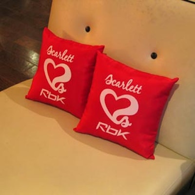 Pillows bearing the Scarlett 'Hearts' Rbk logo adorned lounge furniture.