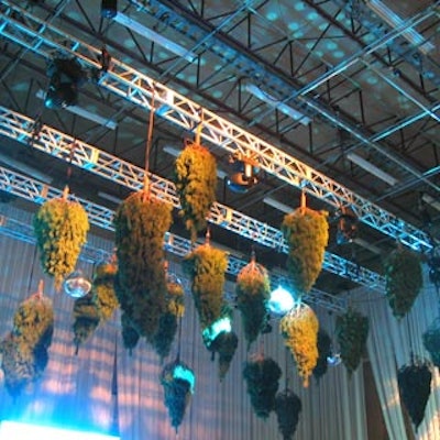 Ceiling-hung disco balls and upside-down evergreens from McNabb Roick Events adorned the space above the dance floor in the after-party room.