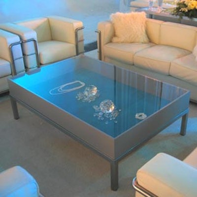 Coffee tables resembling glass display cases contained outsized faux diamonds and other precious stones.