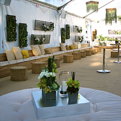 The earthy tan color scheme of the seating and carpeting complemented the green plant decor at the EMA and E! party.