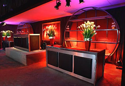 Red lacquer floral containers held simple white roses.