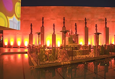 Billy Butchkavitz transformed the pool’s perimeter into a sculpture garden, with large metal, glass, and stone objects evoking armless torsos and slim-necked vases.