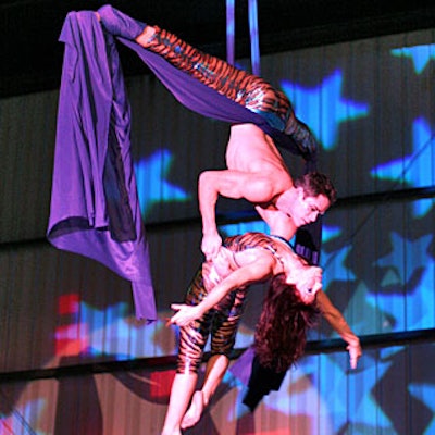 A pair of aerialists entertained dining guests at Grant Thornton’s belated holiday party at Hangar 8.