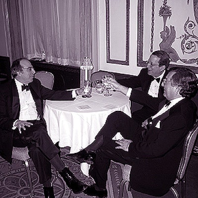 During the cocktail reception before the dinner and awards ceremony, honoree Stephen Shepard (left), editor in chief of Business Week, sat with John Huey, managing editor of Fortune, who presented an award to Time Inc.'s Don Logan, and Edward Kosner, editor in chief of The New York Daily News, who presented an award to Shepard.
