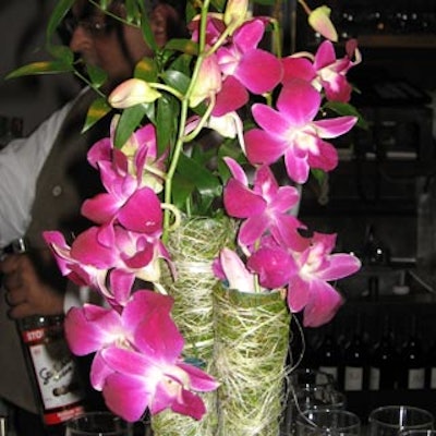 Bright pink orchids in natural cones jazzed up the cocktail tables in the after-party space.