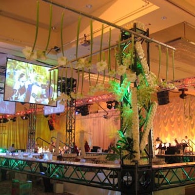 White calla lilies decorated a bar made with a silver lighting truss in the centre of the ballroom.