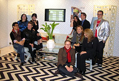 Organizers pulled back a curtain to reveal cast members posed in a living-room-like environment.