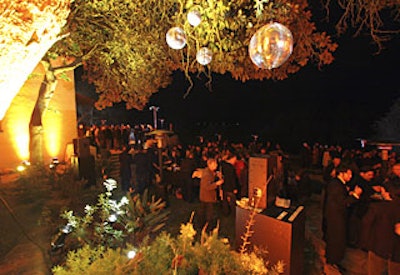 Disco balls hung from the trees in the outdoor courtyard at the Outstanding Performance award party.