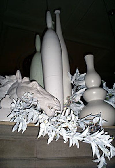Designers sprayed lemon, citrus, lime, and orange branches white and placed them atop mantelpieces and tabletops at the Loggia Ballroom.
