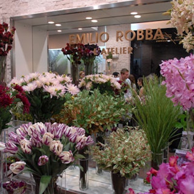 Emilio Robba's newest retail boutique, his first in the United States, features branding on both the arrangements and this mirrored wall.