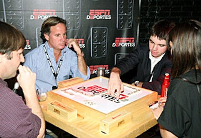 Guests played dominos on special Deportes-logoed tables.