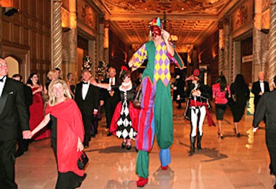 Stiltwalkers strutted among the crowd.