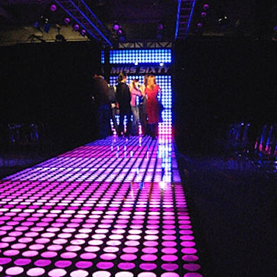 The runway, set up along the eastern side of the building, was inspired by the bottle-glass sidewalks of SoHo and featured a clear acrylic surface backlit with high-intensity LEDs.