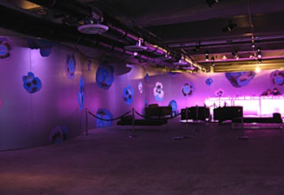 Curvilinear aluminum walls, which acted as partitions between the show space and the after-party, showcased a purple pansy motif that echoed the invitation envelope's design.