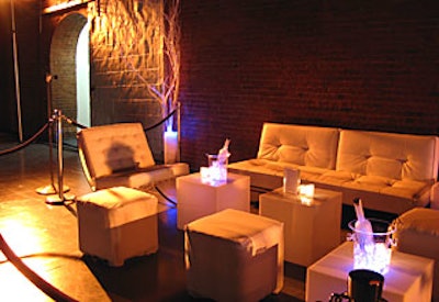 White lounges interspersed throughout the space allowed guests to mingle during the cocktail hour and relax between vignettes.