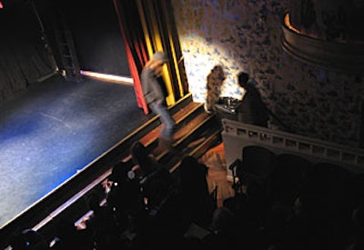 Models entered and exited through a stairwell to the left of the seating (and in front of the stage).