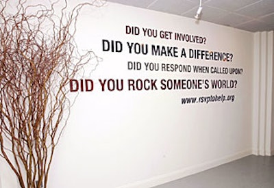 Provocative questions stenciled on the walls served as a call to action for guests.