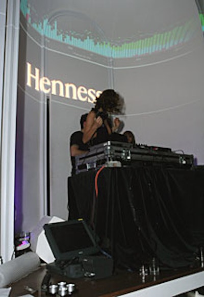 DJ Sky Nellor spun Timbaland's music beneath a logo gobo for sponsor Hennessy and a computer-generated light projection of the equalizer in action.