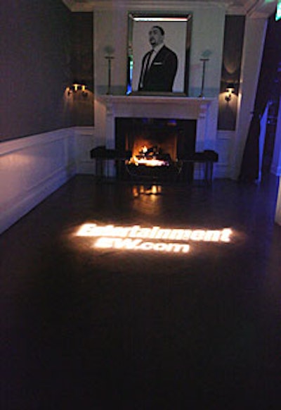 A black-and-white portrait of Timbaland on a mantle atop a roaring fireplace marked the entrance.