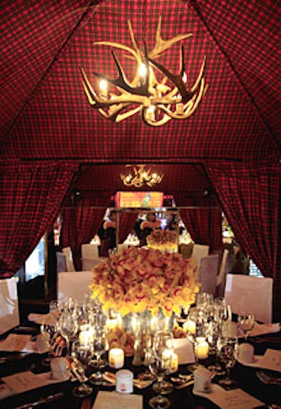 Slatkin & Company worked with Sarah Ferguson, the duchess of York, on a dining tent that showcased the line of candles that carry the duchess’s name. Both the tent fabric and the table covering are Ferguson family tartans. An antler chandelier lent a lodge feel, and the silver flower containers featured stag heads as handles.