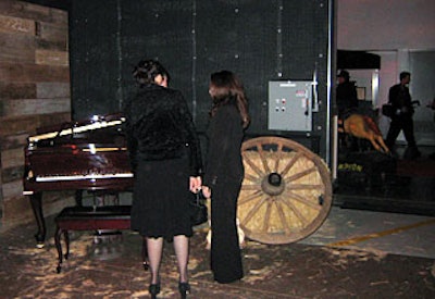 A wagon wheel, rocking horse, and player piano transported guests back to the Wild West in the Western room.