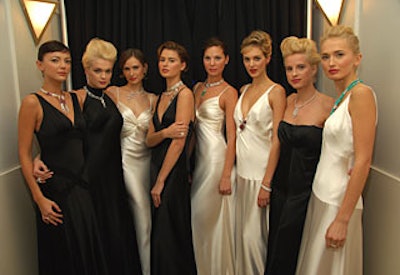 Models, clad in custom-made dresses and lots of jewelry (shown here in New York), paraded around the dining room during dinner, displaying the 100-piece collection.